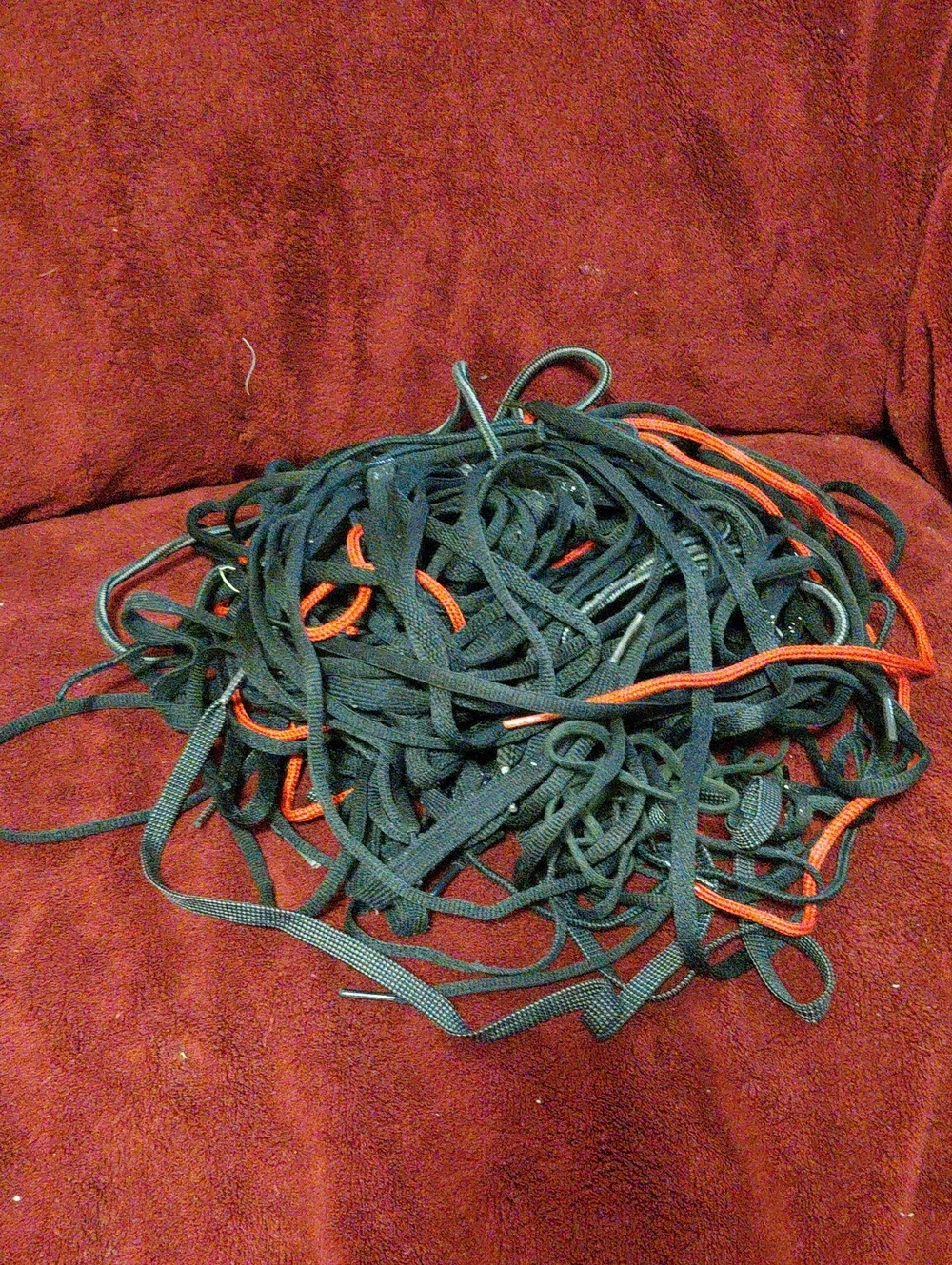 A Pile Of Black Shoe Strings